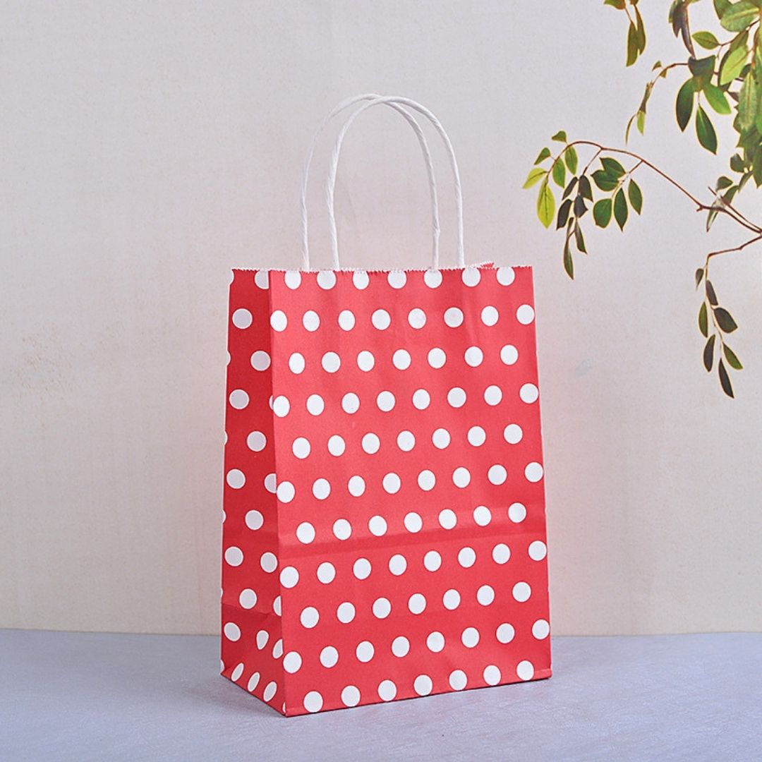 Bolsa de papel kraft con diseño de bolita (medida 15x21x8cm)